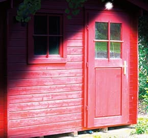 Handy Brite® Solar Security 360 lighting up the area outside of the shed.